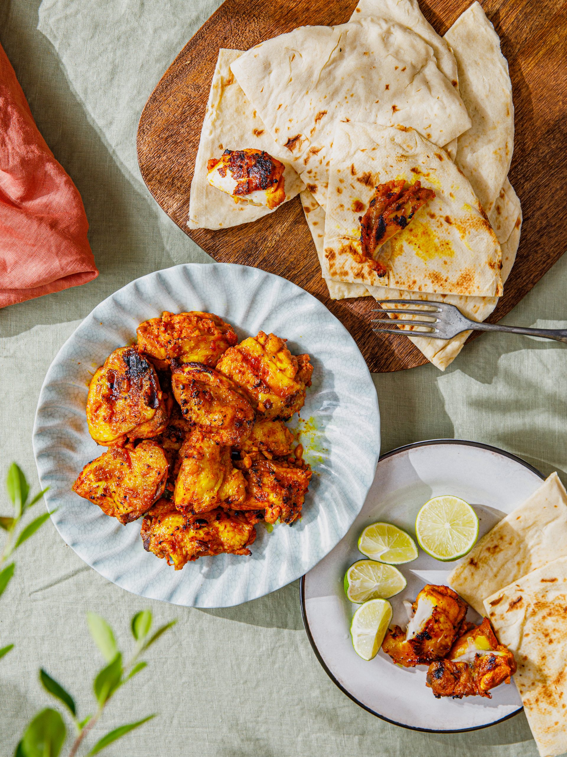 photo of Chicken Tikka and naan on blue plate