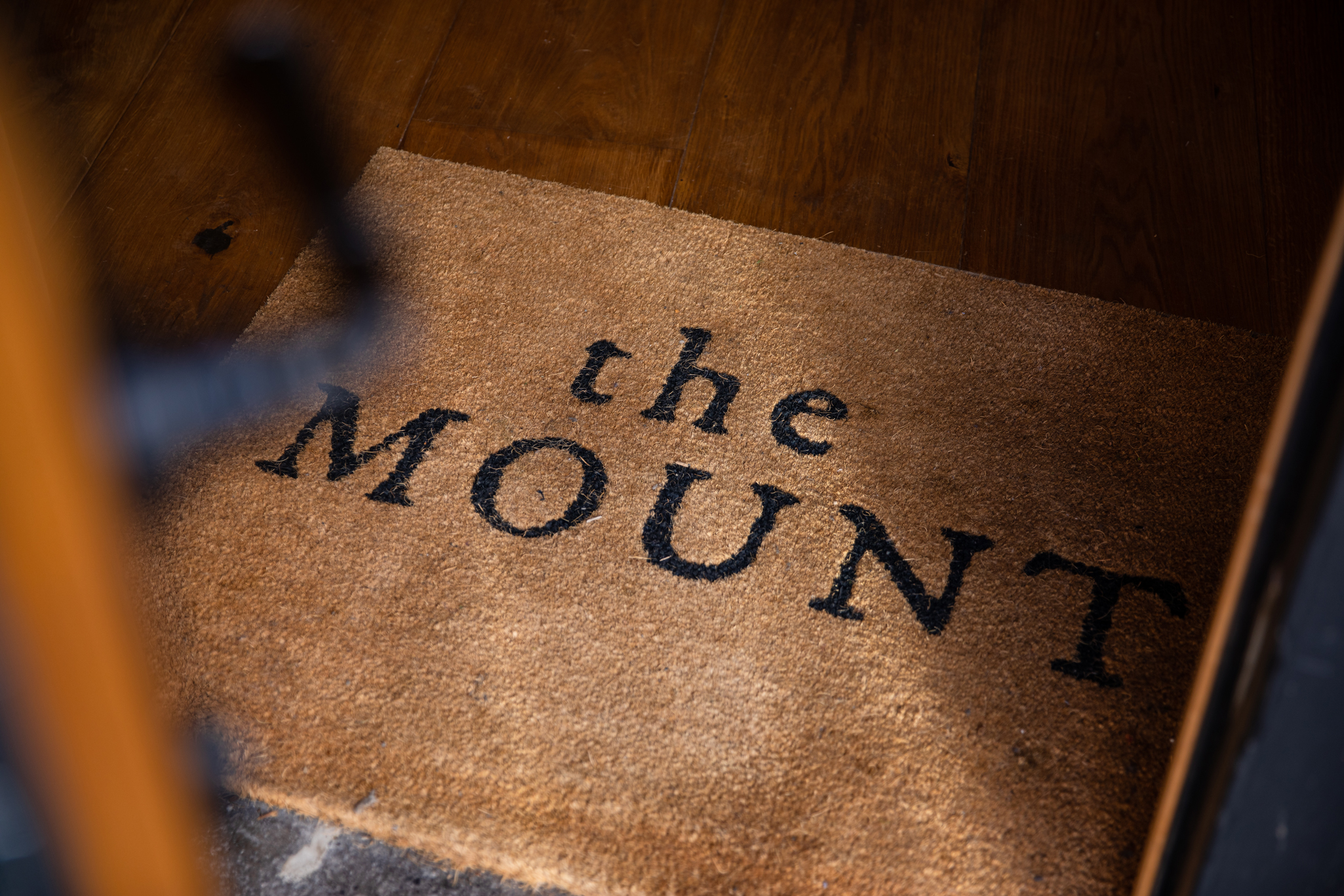 Branded doormat with "The Mount" logo at the entrance of the gastropub in Henley-in-Arden.